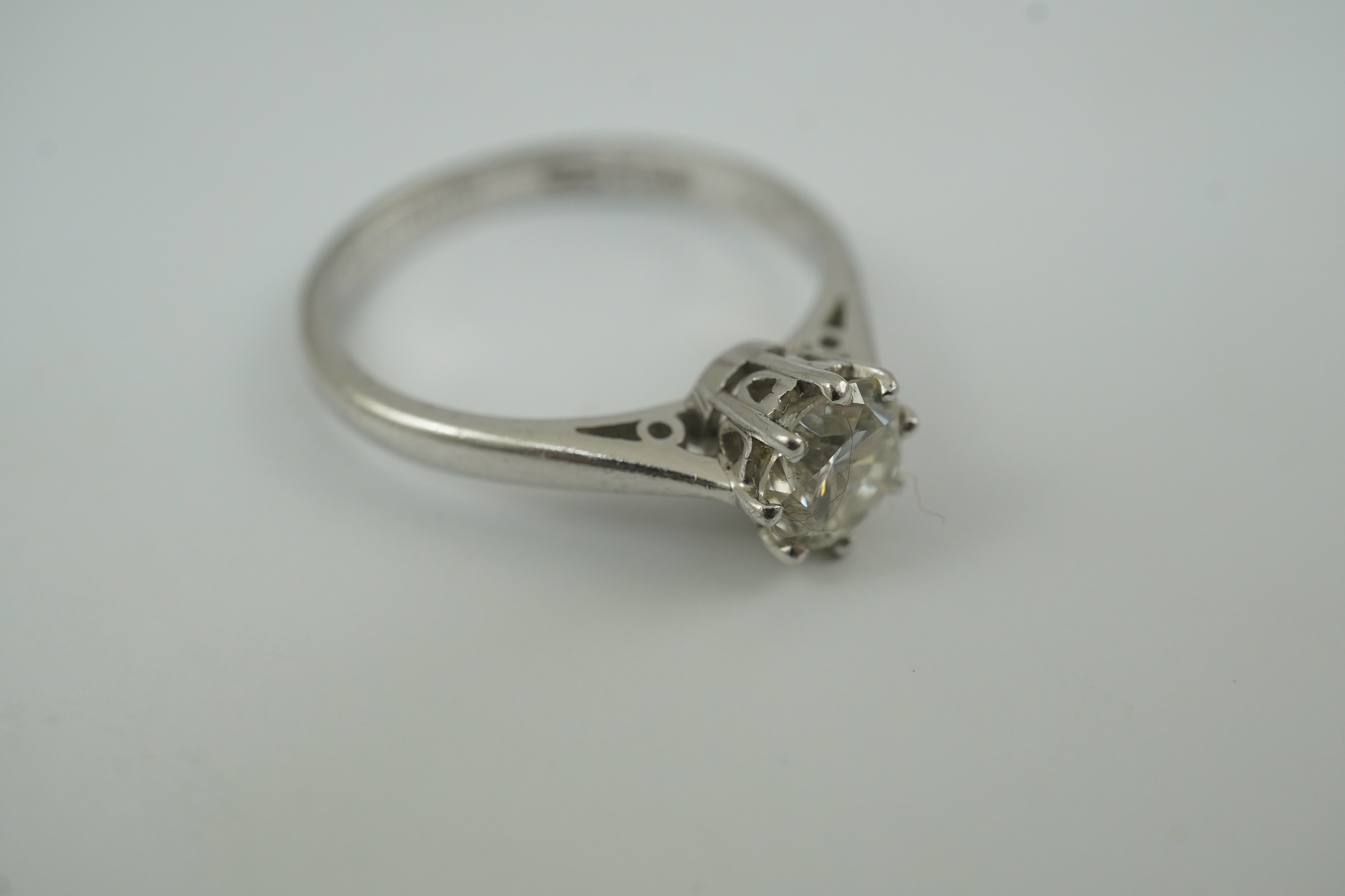 A modern platinum and solitaire diamond set ring